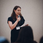 Young leader speaking at event